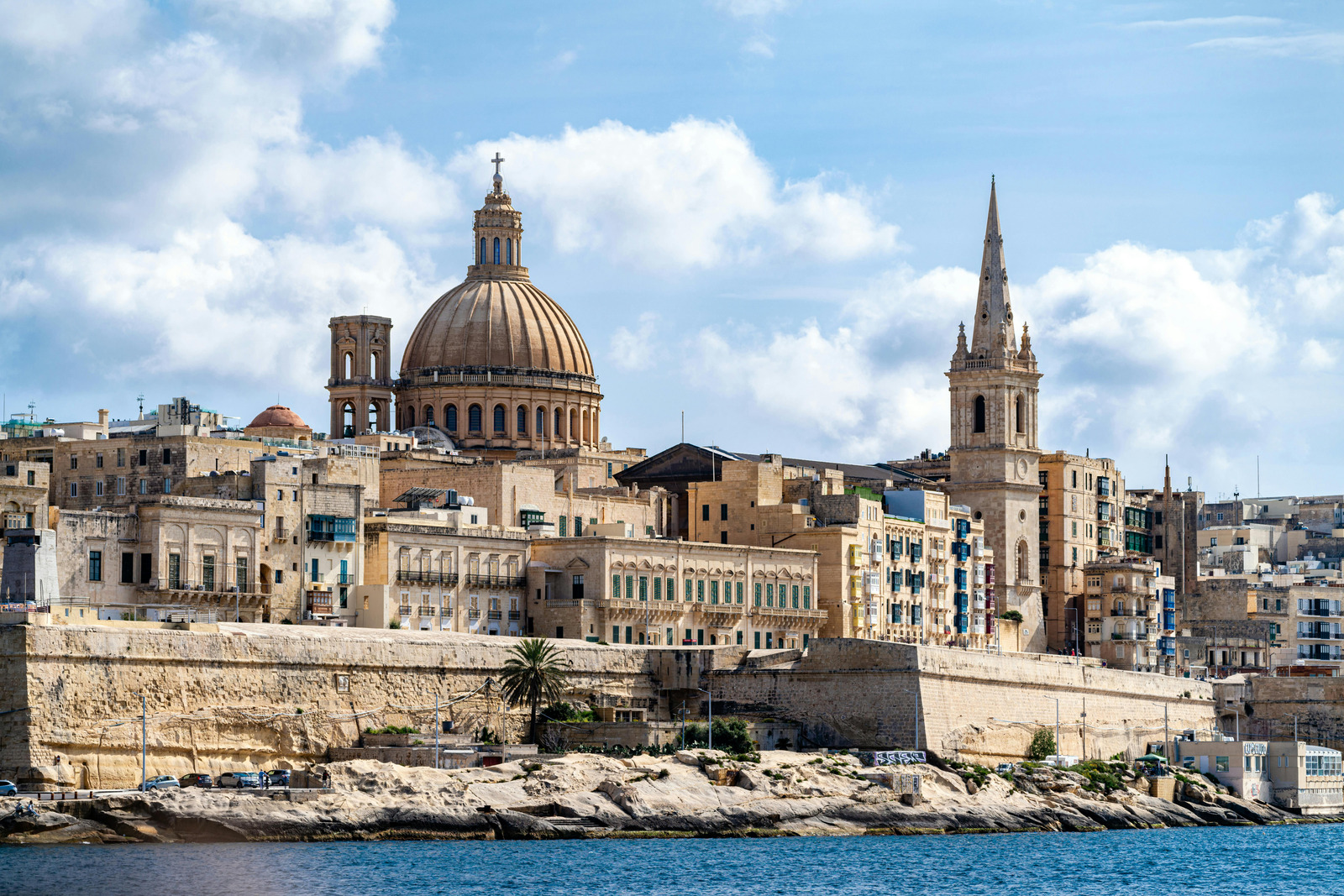 Valletta skyline by day with illuminated dome and harbour