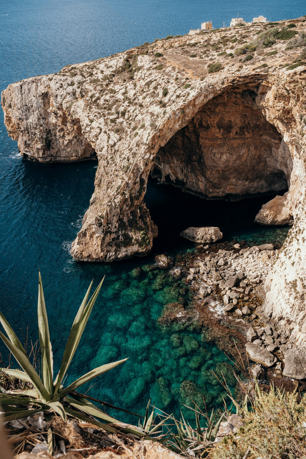 Coastal limestone cave and turquoise sea