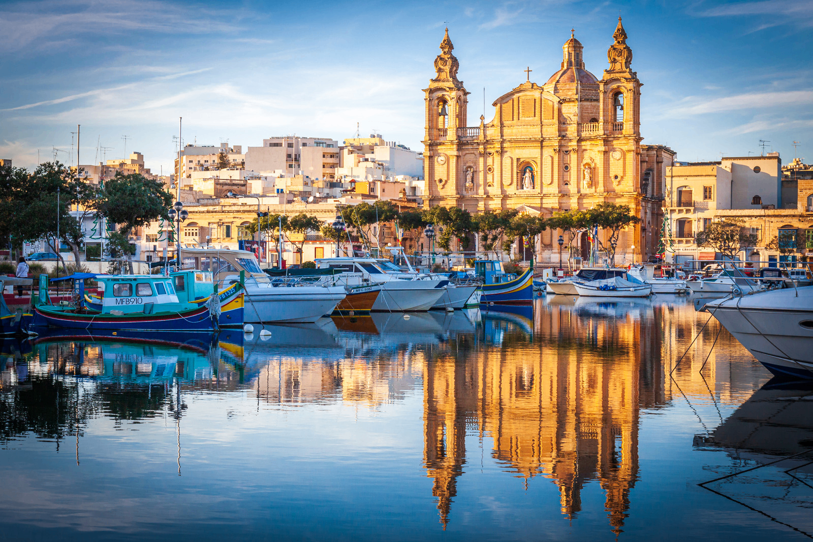 Msida harbour with St Joseph's church at golden hour